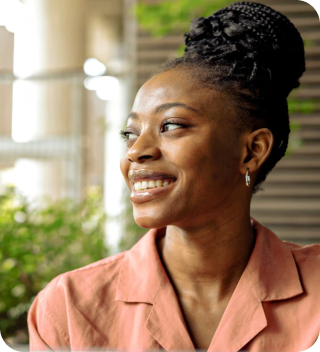 Woman smiling, looking away from the camera